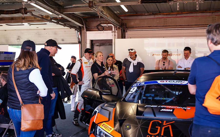 Guests meeting the team in the garage